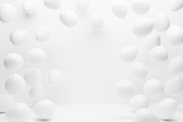 White balloons on white studio background. Birthday party, wedding, anniversary and event celebration backdrop decoration design.