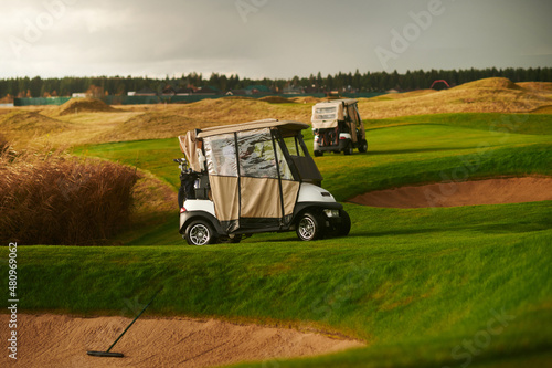 Two golf carts for golf on the course 