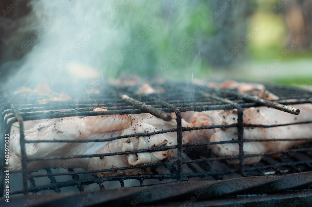 grilled meat on the grill with smoke grilled meat on the grill with smoke