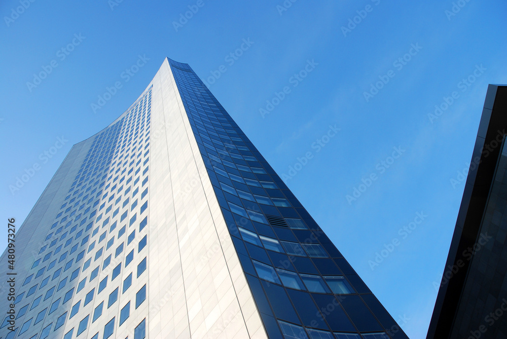 Skyscraper blue sky texture architectural view from the streetlevel Skyscraper blue sky texture architectural view from the streetlevel