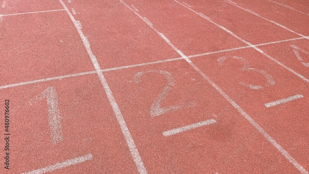 The starting point of the sports field track. Concept of competition, victory, winner, loser.