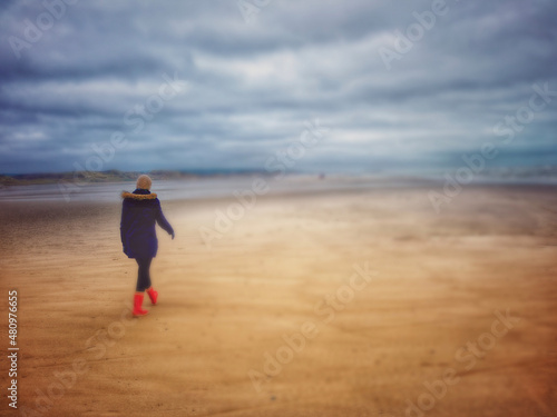 person walking on the beach