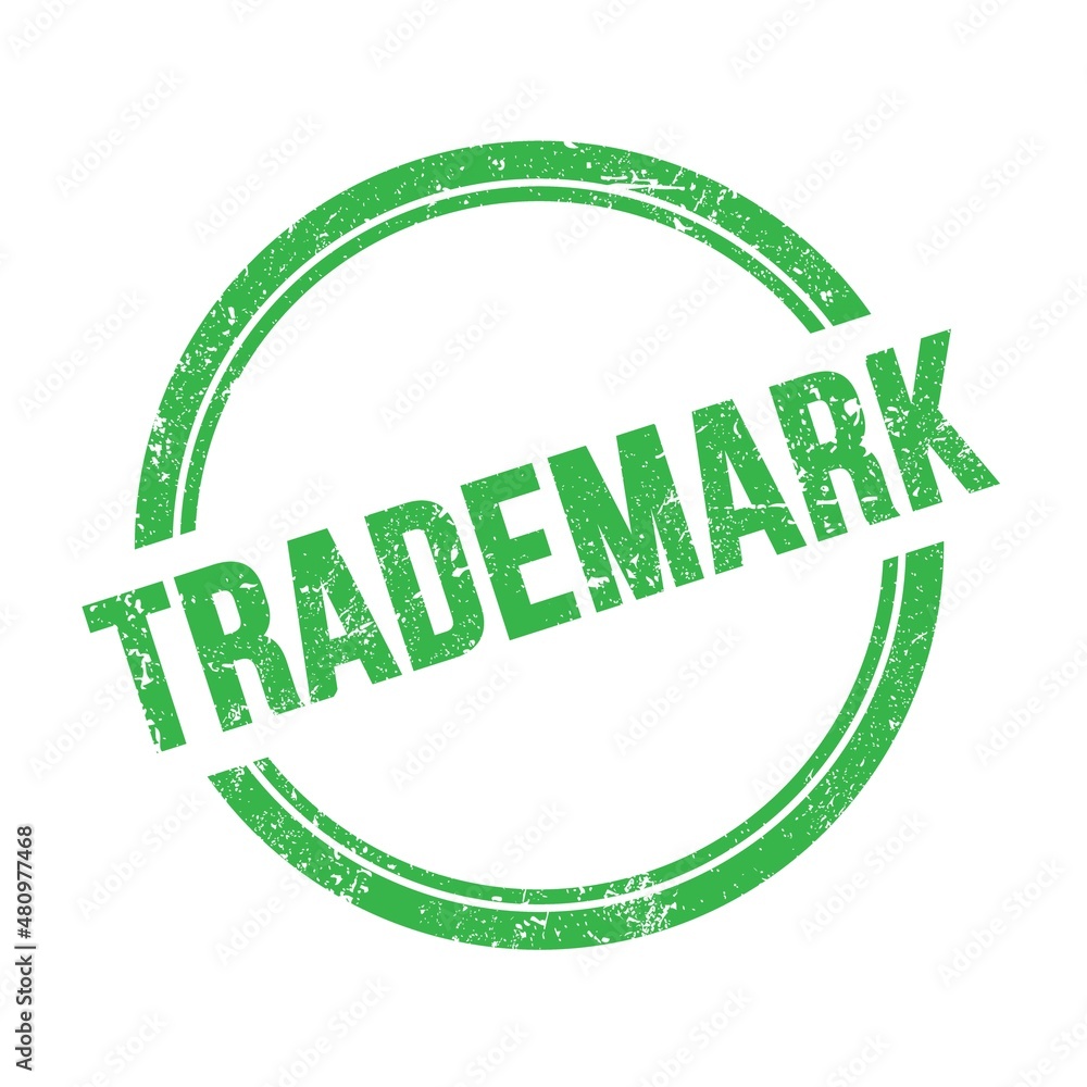 TRADEMARK text written on green grungy round stamp. TRADEMARK text written on green grungy round stamp.