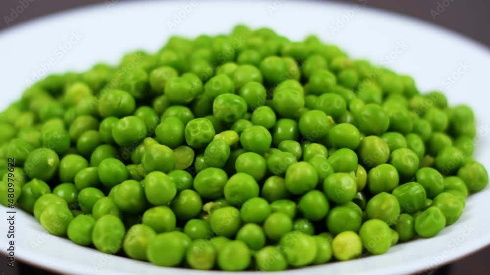 Vegetable Harvest Healthy Eating. Beautiful Texture Close-up of Fresh Green Peas. Healthy Vegetarian food. Close Up Green Peas Background Rotating. Macro Shot Fresh Organic Green Peas. Vegetable Harvest Healthy Eating. Beautiful Texture Close-up of Fresh Green Peas. Healthy Vegetarian food. Close Up Green Peas Background Rotating. Macro Shot Fresh Organic Green Peas.