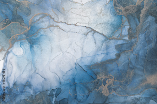Fototapeta Naklejka Na Ścianę i Meble -  Luxury abstract fluid art painting alcohol ink. Background blue, icy gold sparkles. Rich bright abstract pattern.