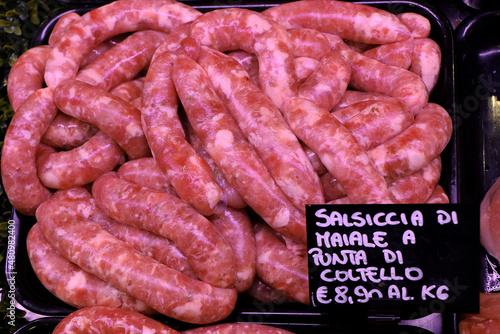 Raw Italian sausage ready to be cooked. Meat for sale in the butcher's shop photo