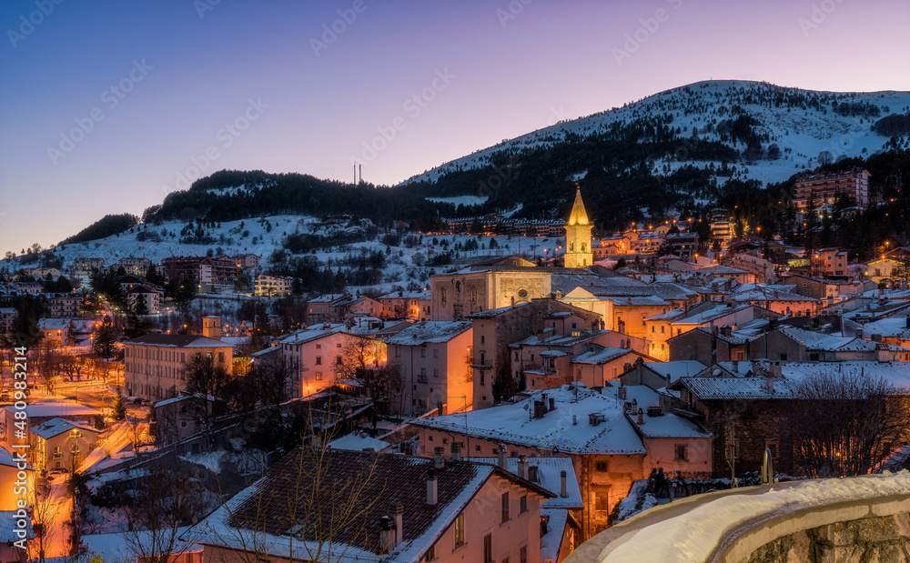 The beautiful village of Pescocostanzo covered in snow and illuminated at night during winter time. Abruzzo, central Italy.