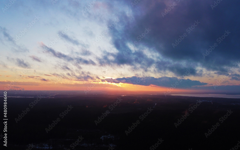 Top view of beautiful sunset with cloudy sky