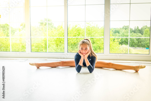girl in sport bodysuit and ballet shoes making stretching exercise Free Download girl in sport bodysuit and ballet shoes making stretching exercise - GFXLoad