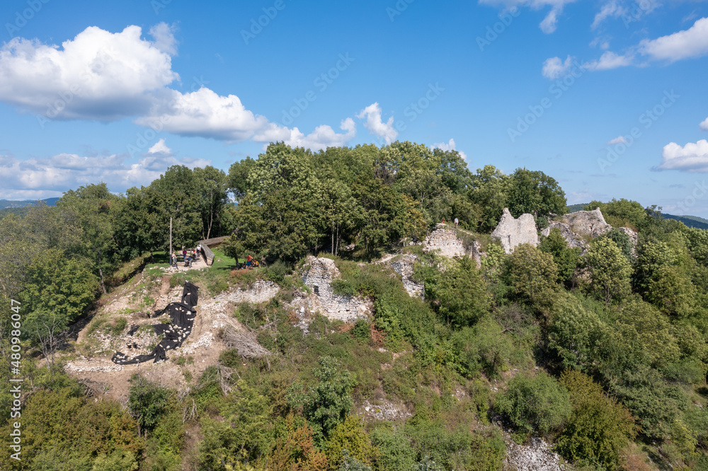 Aerial view of medieval castle ruin Szadvar above the village of Szogliget in Northern Hungary along the border with Slovakia, excavated and newly conserved Aerial view of medieval castle ruin Szadvar above the village of Szogliget in Northern Hungary along the border with Slovakia, excavated and newly conserved