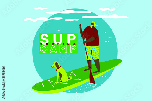 Man and dog standing up on paddle board