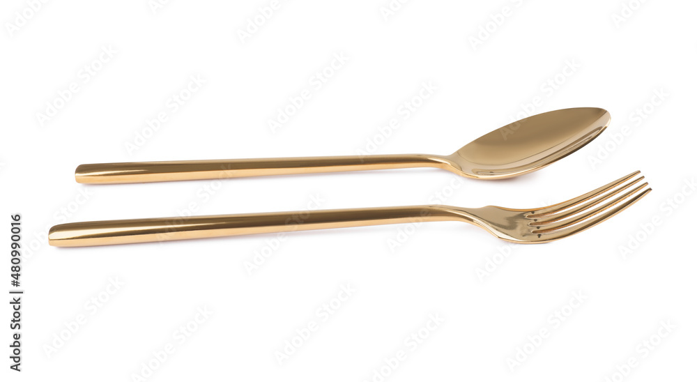 New shiny golden fork and spoon on white background New shiny golden fork and spoon on white background