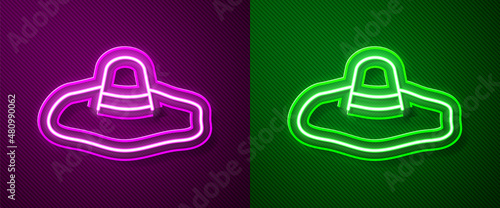 Glowing neon line Elegant women hat icon isolated on purple and green background. Vector