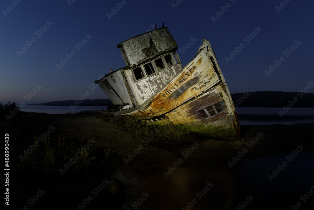The S.S. Point Reyes shipwreck illuminated in the blue hour. Inverness, Point Reyes National Seashore, California, USA. The S.S. Point Reyes shipwreck illuminated in the blue hour. Inverness, Point Reyes National Seashore, California, USA.