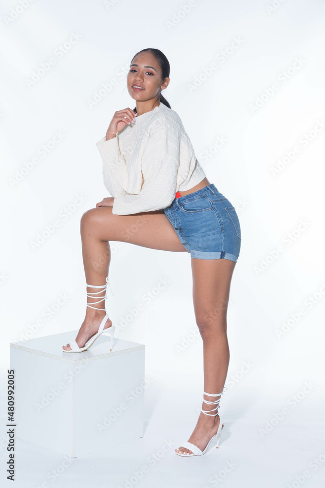 photo of young model in studio on plain background photo of young model in studio on plain background