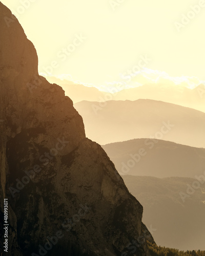 Slope of Punta Euringer mountain and Val Gardena mountain ranges in the morning haze (vertical photo)