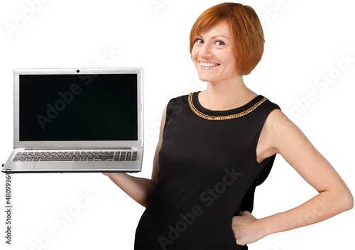 Businesswoman holding a laptop computer