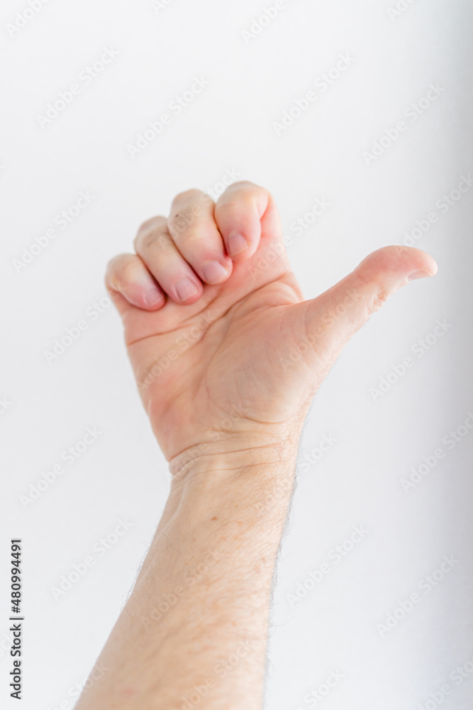 hand of a man with white background doing Passive Finger Flexion. composite. vertical picture hand of a man with white background doing Passive Finger Flexion. composite. vertical picture