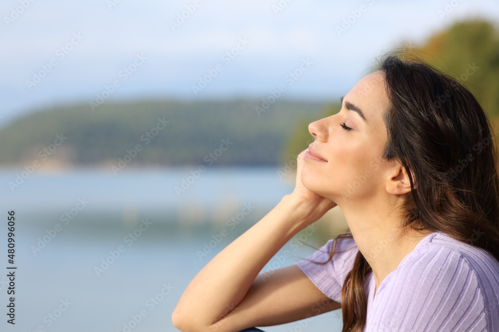 Happy woman relaxing in a lake