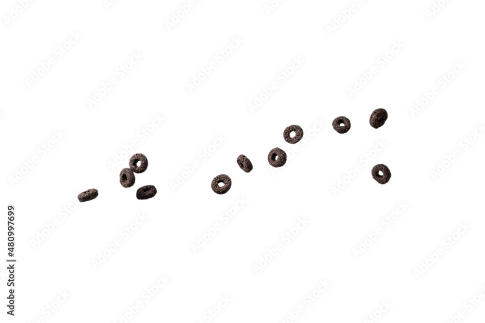 Chocolate rings cereal spill out into a bowl. Breakfast. Chocolate rings cereal spill out into a bowl. Breakfast.