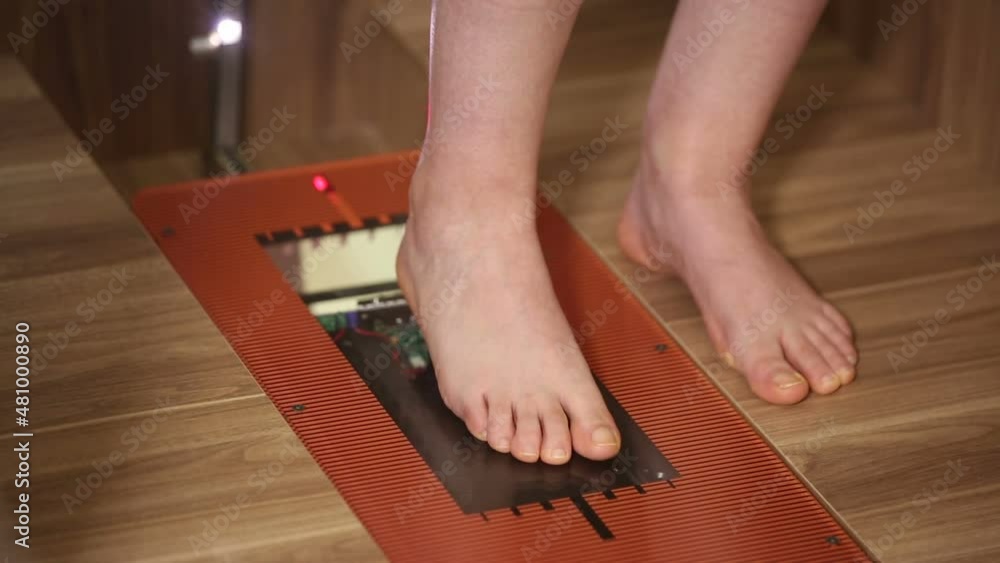 Special orthopedic equipment for feet examination. Female patient