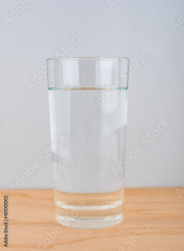 Water glass close up on wooden background