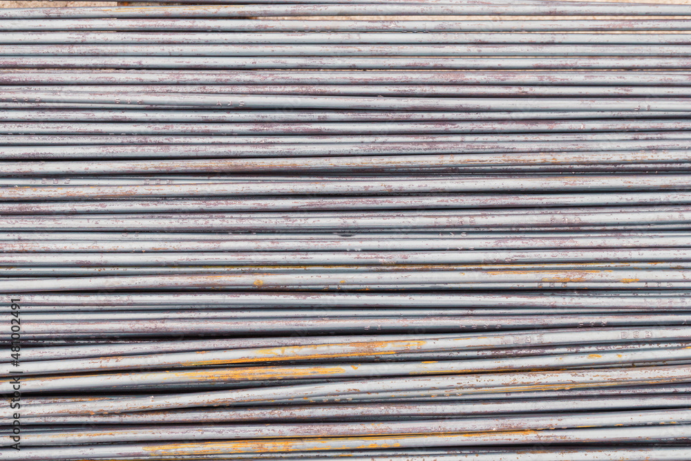 Close up steel rebar for building texture in the construction site. Rebar is an important building material. Rusty iron bars at the construction site. Steel bars with a rusty close-up background. Close up steel rebar for building texture in the construction site. Rebar is an important building material. Rusty iron bars at the construction site. Steel bars with a rusty close-up background.