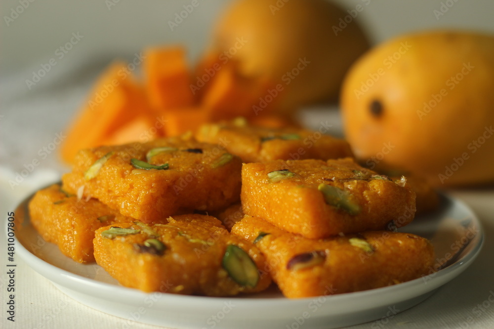 Mango fudge or Mango barfi or Mango kalakand. A mango version of Indian sweet dish Kalakand. Mango fudge or Mango barfi or Mango kalakand. A mango version of Indian sweet dish Kalakand.