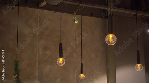 Group of lamps with interesting shape of tungsten filament. Modern lighting of cafe and restaurant.