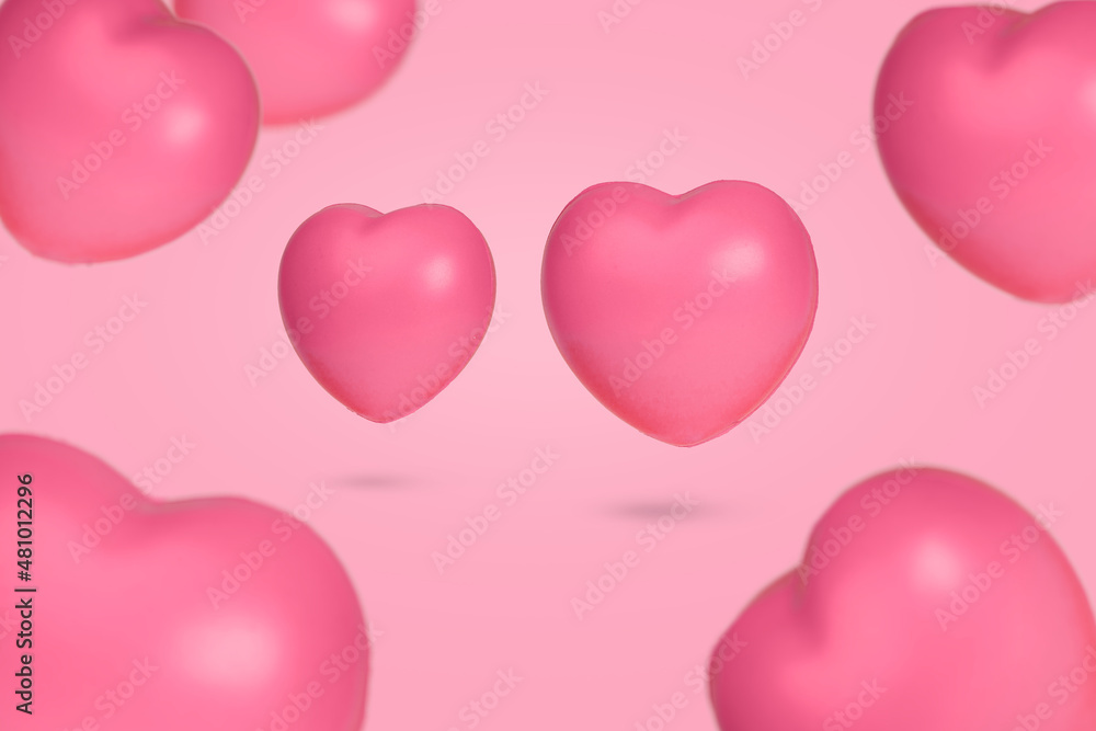 Creative idea with floating hearts in the air on bright pink background.