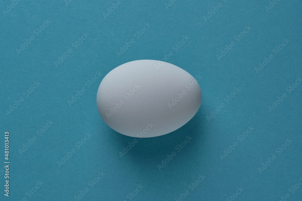 natural white eggs on a blue and yellow background natural white eggs on a blue and yellow background