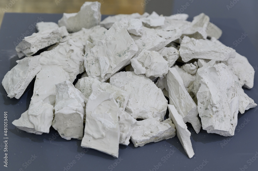 white gypsum stones lie on a gray background