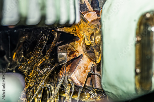 Making gears on a gear cutting machine. Machine oil cools the cutting process of the gear wheel with a modular cutter.