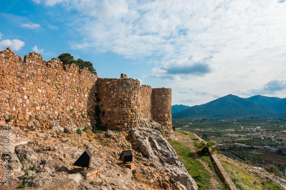 Onda, Castellon province, Spain. Medieval castle remains on top of a hill with mountains in the background. Bien de Interés Cultural historic site.