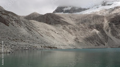 Lagone 69 in the Andes of Peru with beautiful water and lots of ice photo