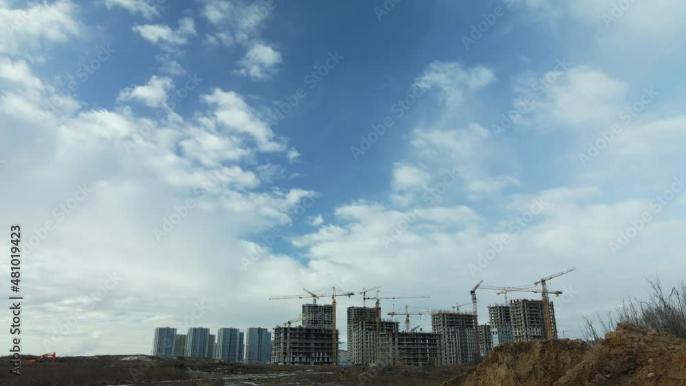 Construction site. Construction of modern high-rise buildings. Work construction cranes. Snow covered earth. Aerial photography. Construction site. Construction of modern high-rise buildings. Work construction cranes. Snow covered earth. Aerial photography.