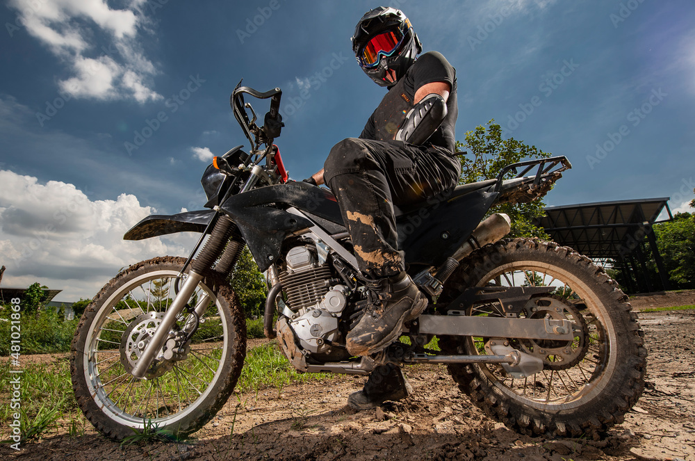 man posing on his dirt bike on race track in Bangkok man posing on his dirt bike on race track in Bangkok