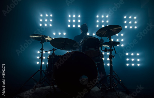 drummer performing in front of audience blinder photo