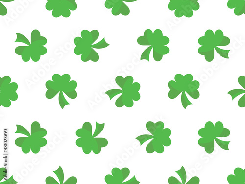 Seamless pattern with green clover leaves on a white background. Festive St. Patrick's Day background with clover for banners, wrapping paper and promotional items. Vector illustration