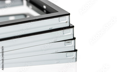 Close up shot of stack of liquid crystal display metal frames on white background