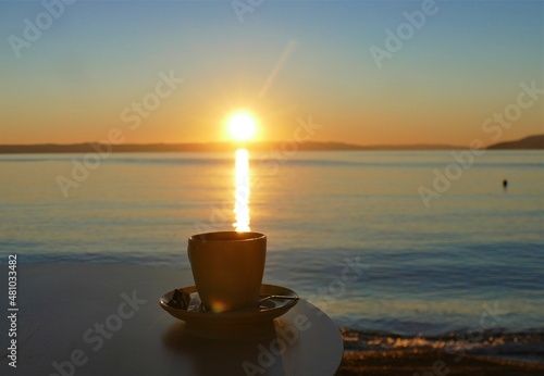 Cup of coffee i0n a beautiful sunset