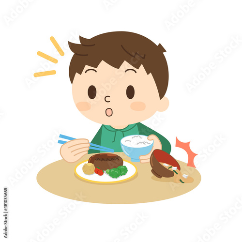 食事中によそ見をして味噌汁をこぼす男の子