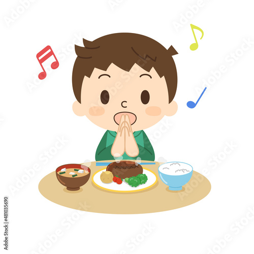 笑顔でいただきますをする男の子