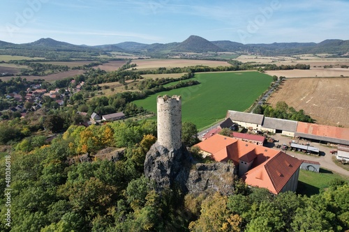 Zámek Skalka historical old castle Skalka in Ceske stredohori region village Vlastislav-Czech republic
scenic aerial panorama view
 photo