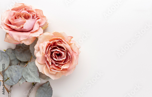 Flowers composition. Bouquet of pink roses in pastel colors. Flatlay.