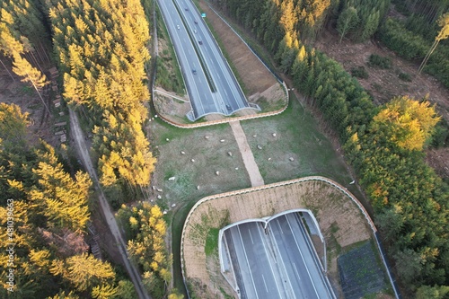 A wildlife bridge Ecoduct biocoridor for wildlife is an overpass that allows animals to cross a road EKODUKT construction aerial panorama view photo