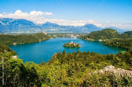 View of Lake Bled in Slovenia. In the background the high rocky corners of the Julian Alps.