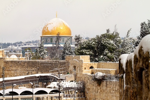 golden dome of the rock jerusalem in snow
