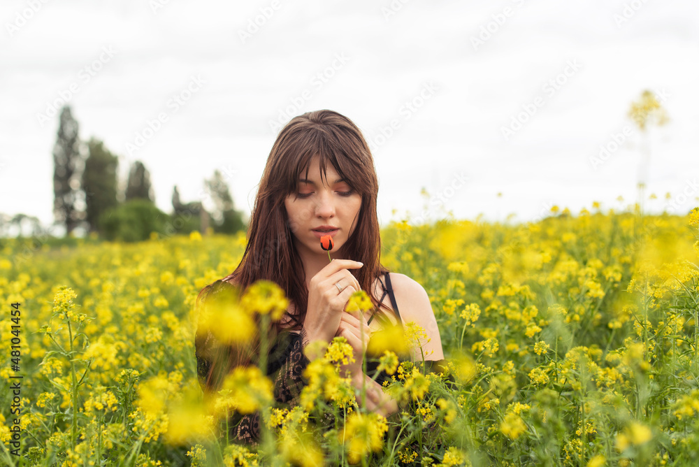Young woman in spring field Young woman in spring field