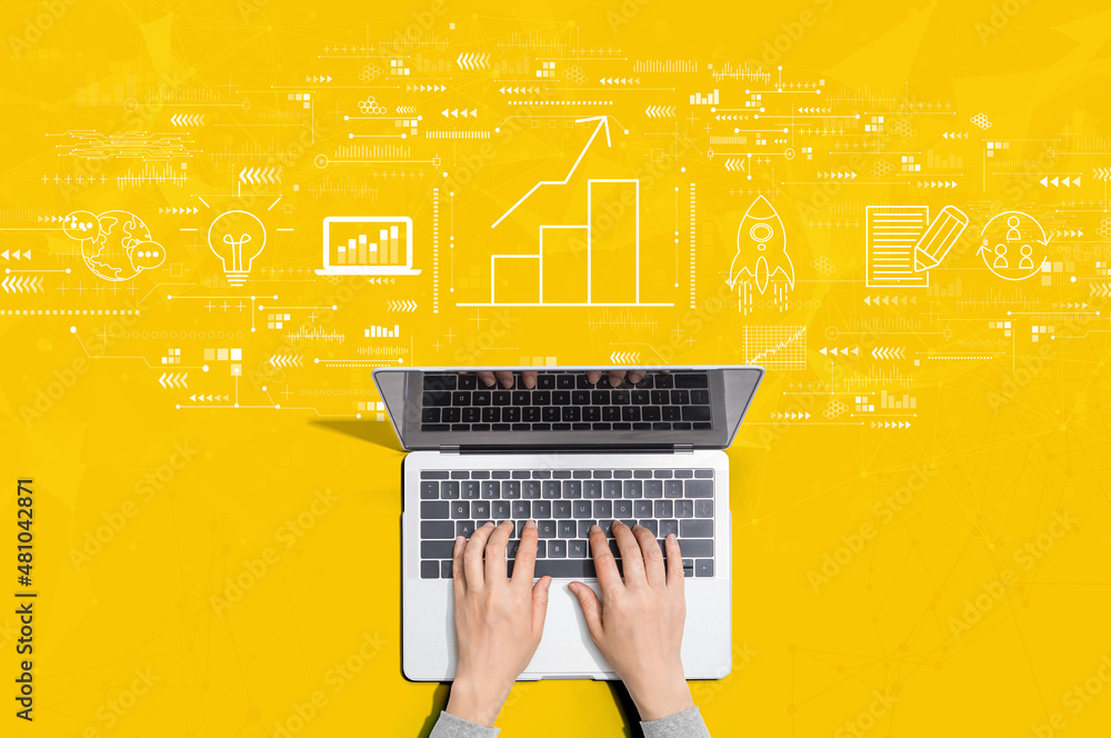 Fotografie Business growth analysis with person using a laptop computer